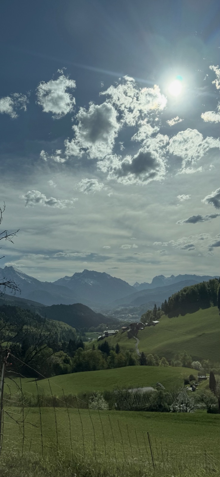 A shared photo in the Kreis app: a sunlit alpine valley.